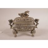 A Chinese silvered metal censer and cover with two dragon form handles and all over dragon