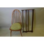 A blonde Ercol hoop back dining chair, and an Ercol plate rack
