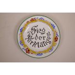 A Russian style porcelain cabinet plate decorated with the German propaganda slogan 'Sieg der