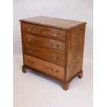 A Georgian style mahogany chest of four graduated drawers, with cockbeading and brass swan neck