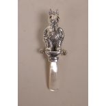 A sterling silver baby's rattle in the form of Peter Rabbit, with a mother of pearl handle, 3½" long