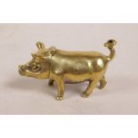 A brass vesta case in the form of a pig, 2" long