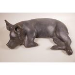 A large bronze recumbent pig, 18½" x 14"