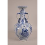 A Chinese blue and white porcelain two handled vase decorated with figures in a landscape, 13" high