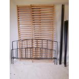 A Habitat iron framed double bed, with wood slatted base, 62" wide