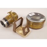 A vintage magic lantern lens, 4" diameter, together with a vintage focus lens by Wray of London,