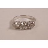 A 14ct white gold three stone diamond ring, approximately 1.91 carats, approximate size 'N'
