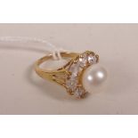 A ladies' yellow metal and pearl ring, approximate size 'N/O'