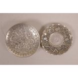 A Chinese white metal coin dish decorated with the emblems of the Eight Immortals, together with a
