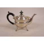 A hallmarked silver teapot with ebonised wood handles, London 1905, 279 grams total