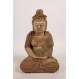 A Chinese carved and painted wood figure of Buddha, 9" high