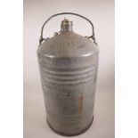 A large vintage Shell Oils '40' cylindrical container with brass screw cap and swing handle, 24"