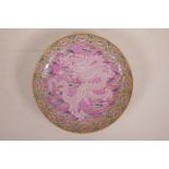 A Chinese polychrome porcelain cabinet dish with dragon and flaming pearl decoration on a rose