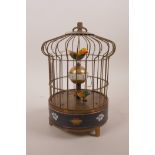 A brass birdcage automaton clock with cloisonné decoration, 7½" high x 5½" diameter