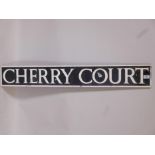 An enamelled metal street sign, 'Cherry Court', 42" x 6"
