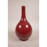 A Chinese sang de boeuf glazed porcelain bottle vase, 6 character mark to base, 9½" high
