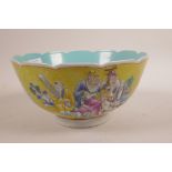 A Chinese yellow ground porcelain bowl with a lobed edge, decorated with polychrome enamels