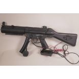An automatic BB gun, 26" long, comes with charger