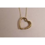 A 9ct yellow gold, diamond set, heart shaped pendant on a gold chain, 1" wide