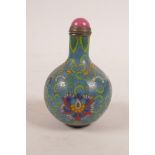 A Chinese cloisonné snuff bottle decorated with lotus flowers and auspicious symbols, 3" high
