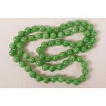 A jade bead necklace, 33" long