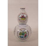 A Chinese double gourd porcelain vase with polychrome porcelain panels depicting flowers, gourds and