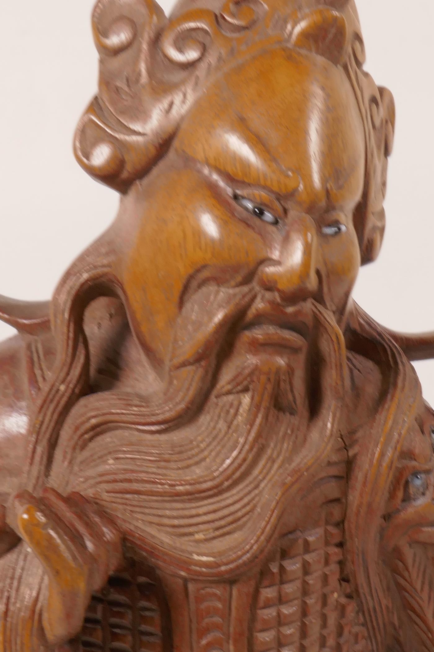 A Chinese carved hardwood figure of a sage with bone and glass eyes, 12" high - Image 3 of 4
