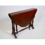 A Victorian walnut Sutherland table with a shaped top, 35½" wide x 28" high