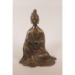 A Chinese bronzed metal figure of Buddha, inscription verso, 9" high