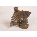A Vienna bronze figurine of two children playing with a large fan, 4" high