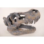 An ornamental composition model of a T Rex dinosaur skull, 16" long