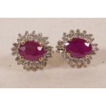A pair of 14 carat yellow gold, ruby and diamond cluster earrings, approximately 2cts