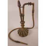 An Eastern engraved brass Hookah in the form of a gourd, with wire bound hose, 16" high