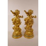 Two gilt painted carved wood figurines of putti musicians, 13½" high