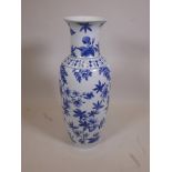 A Chinese blue and white porcelain floor vase decorated with flowering branches, 36" high