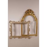 A Florentine design carved picture frame, with arched top, together with a carved and silvered