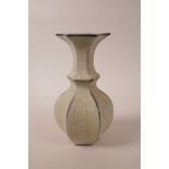 A Chinese cream crackle glaze pottery vase of hexagonal form, raised character marks to base, 9"