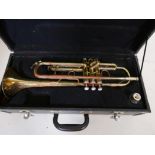 A vintage brass trumpet in fitted case