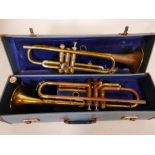 A vintage Corton trumpet, cased, and another for restoration