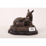 A filled bronze figure group of a deer and fawn, mounted on a painted composition base, 7" x 6" high