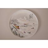 A Chinese polychrome porcelain cabinet plate decorated with a winter landscape, character marks to