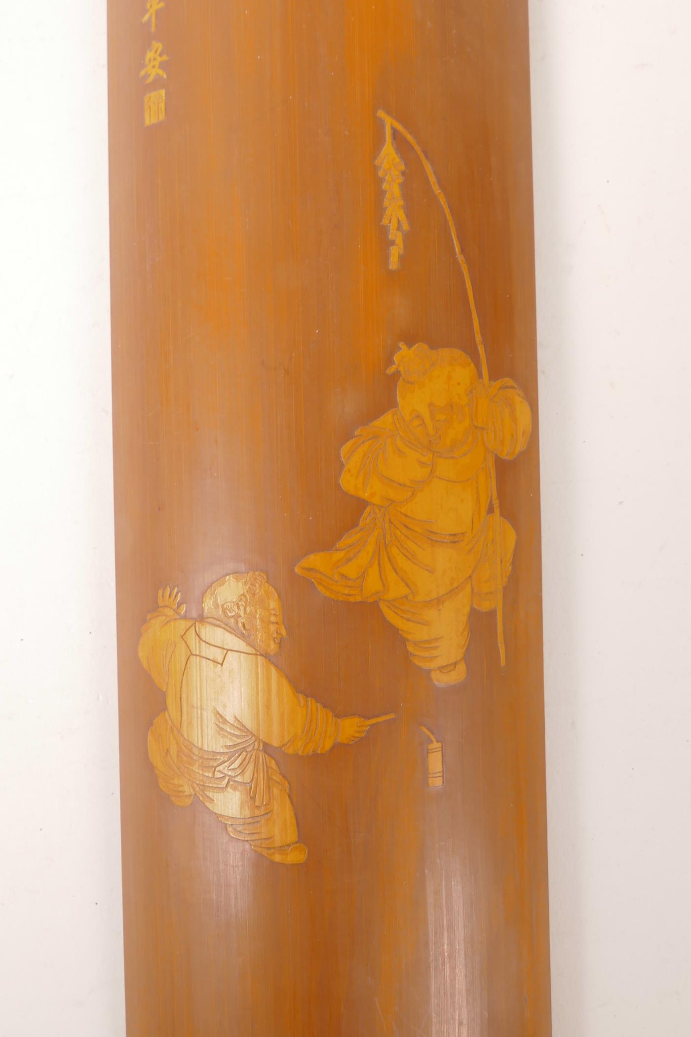 A Chinese carved bamboo wrist rest decorated with boys playing with fireworks, 12" long - Image 3 of 3
