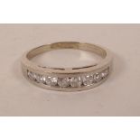 An 18ct white gold and diamond set half eternity ring, approximately ½ct, approximate size 'S'