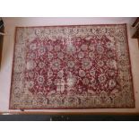 A contemporary 'Alhambra' design red ground rug with worn features, 89" x 64"