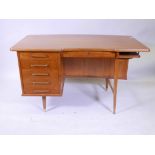 A mid C20th teak 6 drawer desk, with open shelves to the back, 51" x 28", 29½" high