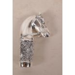 A white metal walking stick handle in the form of a horse's head, stamped 800, 3½" long