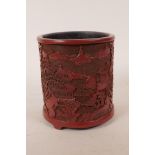 A Chinese Cinnabar lacquer style brush pot decorated with landscape scenes, impressed seal mark to