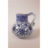 A Chinese blue and white porcelain wine jug with scrolling lotus flower decoration, 4 character mark