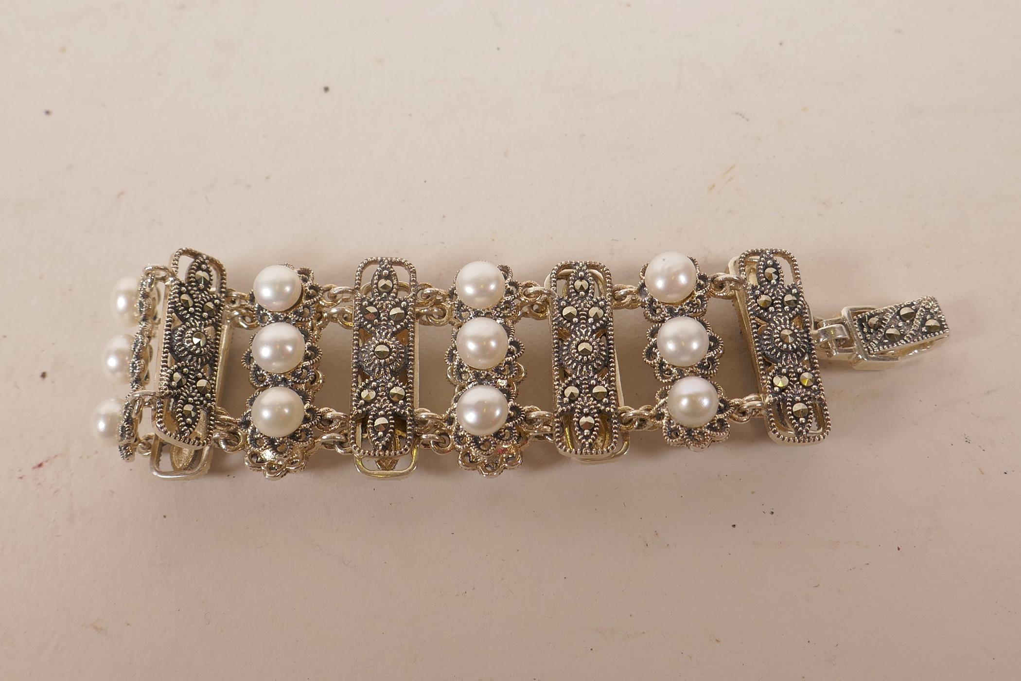 A silver, marcasite and freshwater pearl set bracelet, 7" long