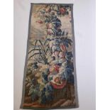 An antique verdure tapestry fragment, possibly C18th Flemish, mounted on a linen back, 32" x 75"